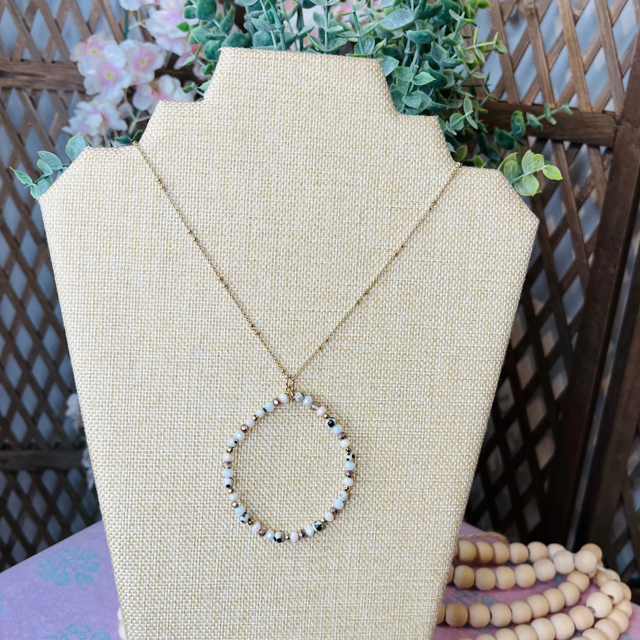 beaded circle pendant w/ leopard accent necklace